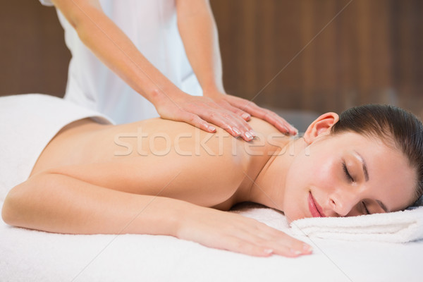 Attractive woman receiving back massage at spa center Stock photo © wavebreak_media