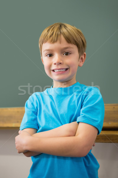 Happy pupil smiling at camera in classroom Stock photo © wavebreak_media