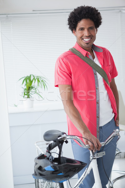 Happy businessman standing with his bike Stock photo © wavebreak_media