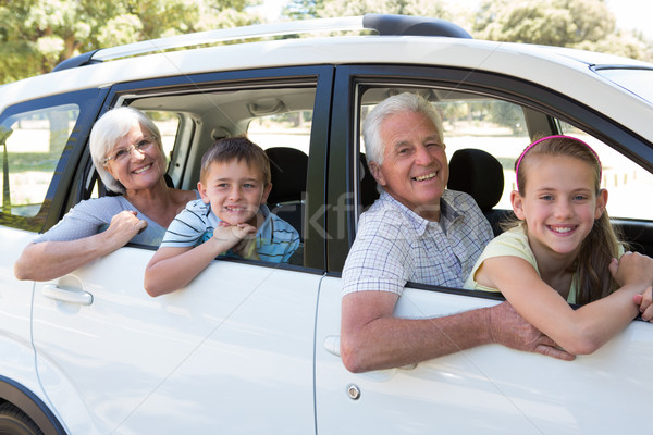 Stock photo: Grandparents going on road trip with grandchildren