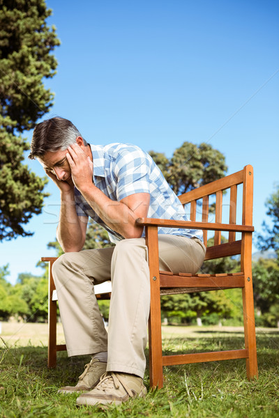 Bouleversé homme séance parc banc [[stock_photo]] © wavebreak_media