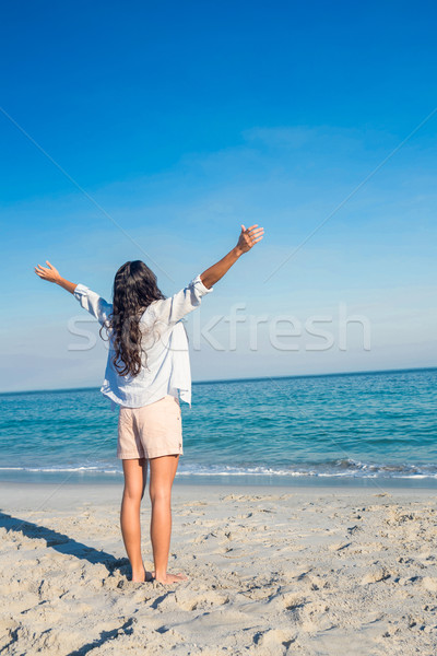 Happy woman with arms outstretched at the beach Stock photo © wavebreak_media