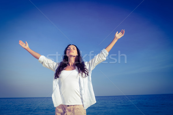 Happy woman with eyes closed at the beach Stock photo © wavebreak_media
