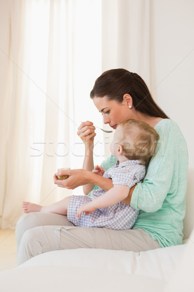 Happy mother eating with her baby boy  Stock photo © wavebreak_media