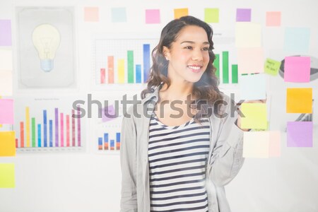 Jeunes concentré femme d'affaires regarder comprimé [[stock_photo]] © wavebreak_media