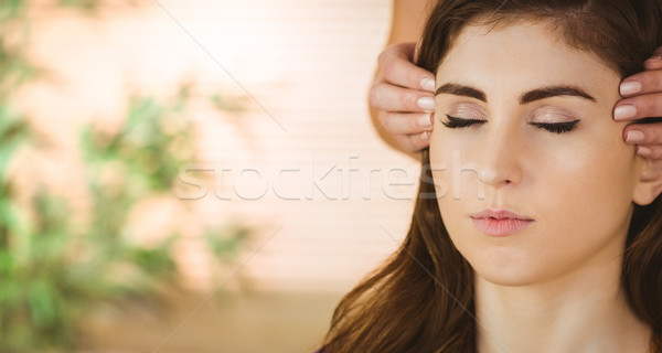 Stock photo: Young woman having a reiki treatment