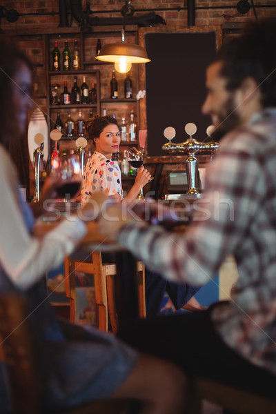Stock photo: Jealous woman looking at couple flirting with each other