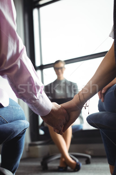 Mid section of couple holding hands Stock photo © wavebreak_media
