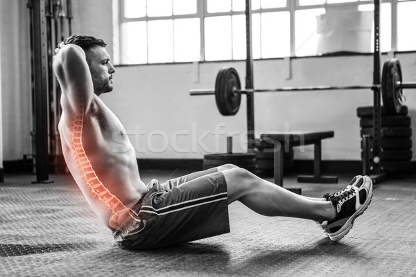 Highlighted spine of exercising man at gym Stock photo © wavebreak_media