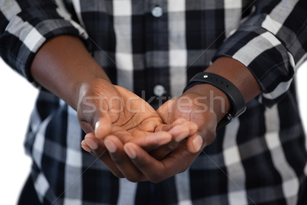 Man standing with hands cupped against white background Stock photo © wavebreak_media