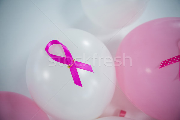 High angle view of pink Breast Cancer ribbons on balloons Stock photo © wavebreak_media