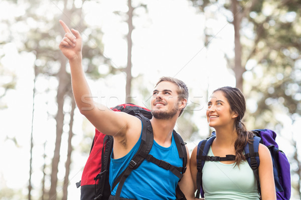 Stock photo: Young happy joggers looking at something in the distance