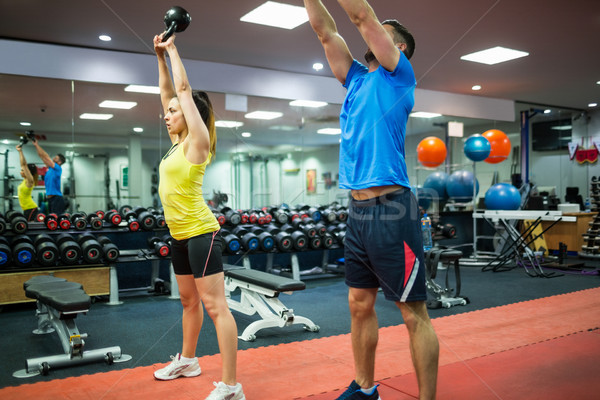 Man and woman working out using kettle bells Stock photo © wavebreak_media