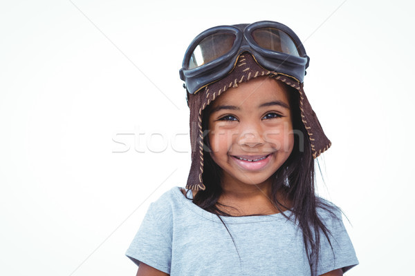 Smiling girl pretending to be pilot Stock photo © wavebreak_media