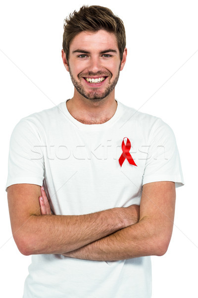 Zâmbitor om cu bratele incrucisate alb roşu Imagine de stoc © wavebreak_media