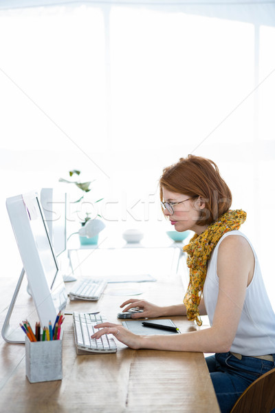thoughtful hipster businesswoman concentrating on her computer Stock photo © wavebreak_media