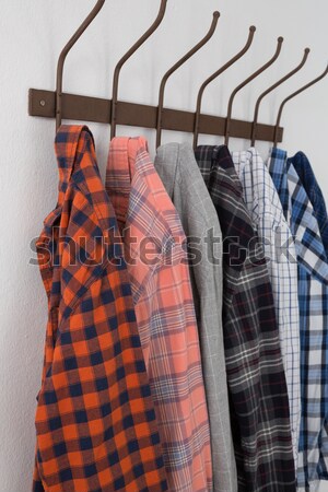 Stock photo: Close-up of warm clothes hanging on hook