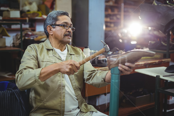 Shoemaker hammering on a shoe Stock photo © wavebreak_media