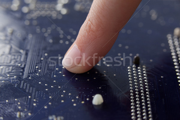 Hand of a woman touching motherboard Stock photo © wavebreak_media