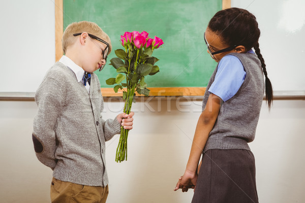 Student giving flowers to another student Stock photo © wavebreak_media