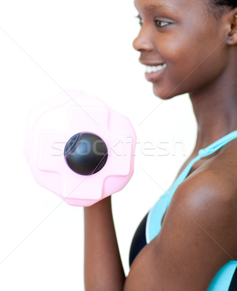 Jolly woman working out with dumbbell  Stock photo © wavebreak_media