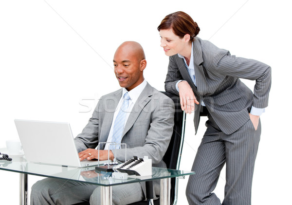 Stock photo: Two business partners working on a laptop