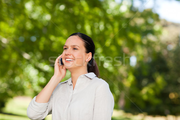 Young woman phoning in the park  Stock photo © wavebreak_media