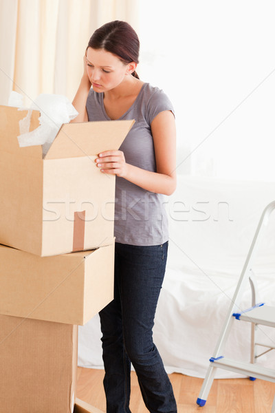 A woman is searching in a cardboard Stock photo © wavebreak_media