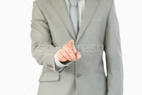 Businessman's finger activating futuristic touchscreen against a white background Stock photo © wavebreak_media