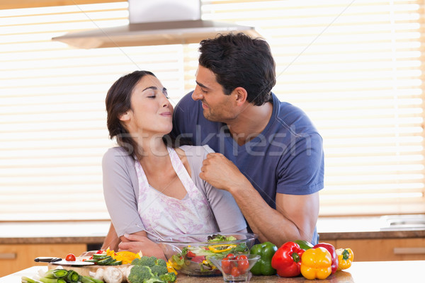 Man feeding his fiance in their kitchen Stock photo © wavebreak_media