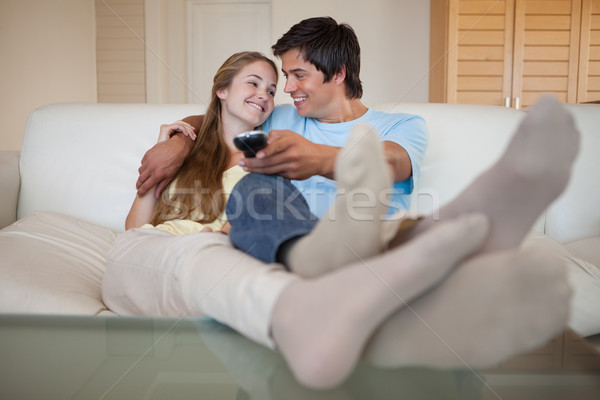 In love couple watching television in their living room Stock photo © wavebreak_media
