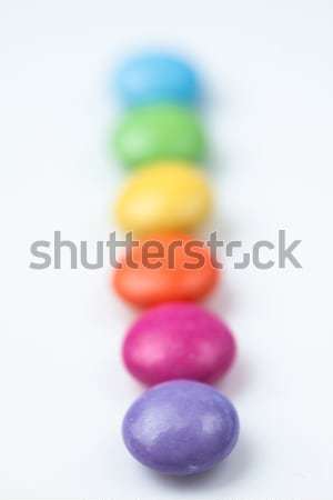Rank of candies multi coloured against a white background Stock photo © wavebreak_media