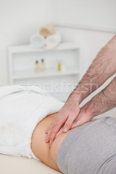 Woman lying while a physiotherapist massing her back in a physio room Stock photo © wavebreak_media