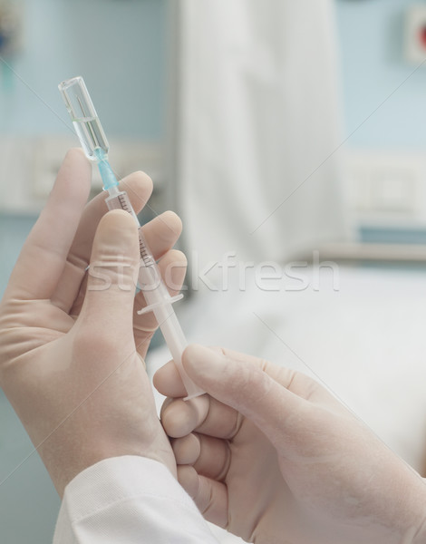 Close up of doctor preparing a syringe in hospital ward Stock photo © wavebreak_media