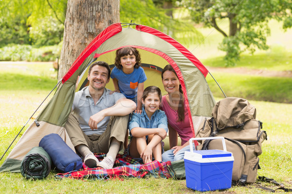 Couple with kids sitting in the tent at park Stock photo © wavebreak_media
