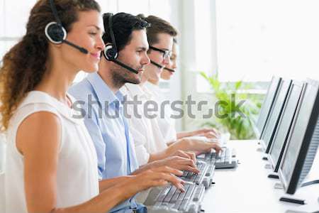 Customer service representatives working at desk Stock photo © wavebreak_media