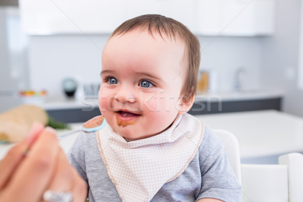 Happy baby being fed by mother Stock photo © wavebreak_media