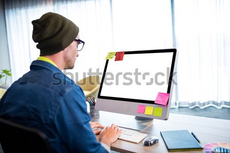 Stylish blonde using tablet pc with app icons and cloud on board Stock photo © wavebreak_media