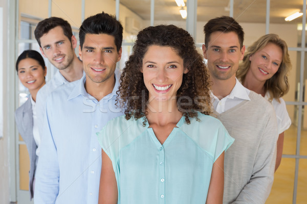 [[stock_photo]]: Heureux · équipe · commerciale · souriant · caméra · ensemble