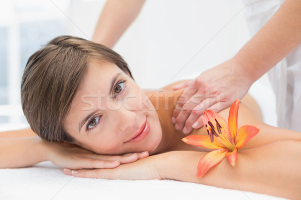 Attractive woman receiving shoulder massage at spa center Stock photo © wavebreak_media