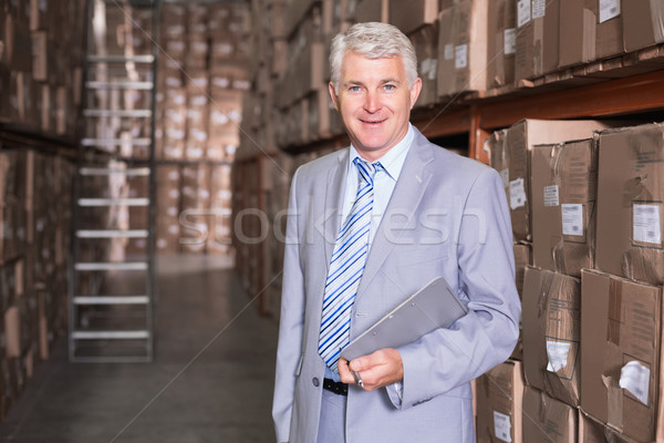 Warehouse manager smiling at camera Stock photo © wavebreak_media