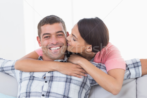 Happy man being kissed by woman Stock photo © wavebreak_media