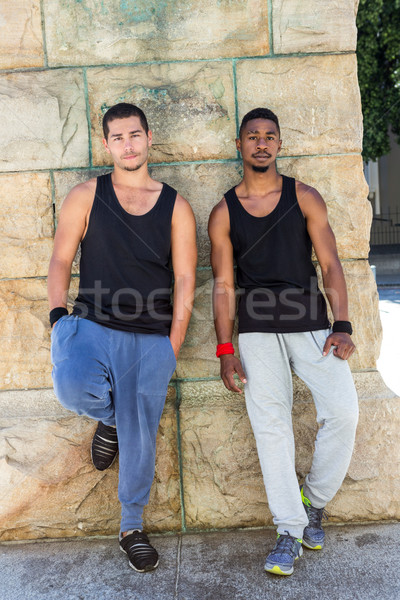 Happy friends doing parkour in the city Stock photo © wavebreak_media