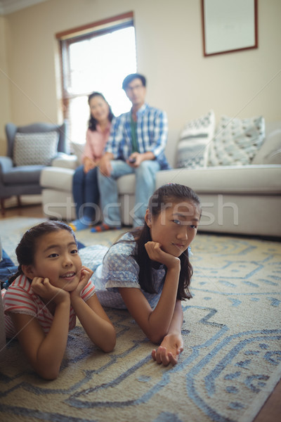 Famille ensemble salon maison télévision [[stock_photo]] © wavebreak_media