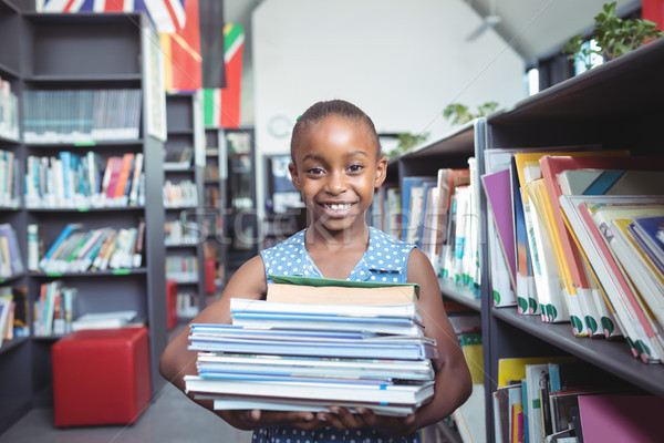 Zâmbitor fată cărţi bibliotecă portret Imagine de stoc © wavebreak_media