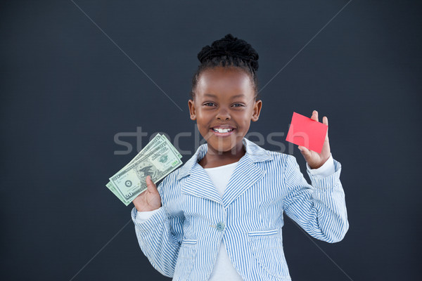 ストックフォト: 肖像 · 笑みを浮かべて · 女性実業家 · 通貨 · 赤