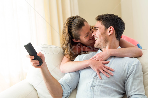 Lachen Fernsehen Wohnzimmer Frau Mann Stock foto © wavebreak_media