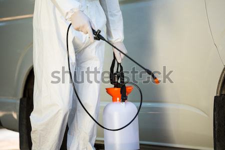 Midsection of manual worker using spray on wall Stock photo © wavebreak_media