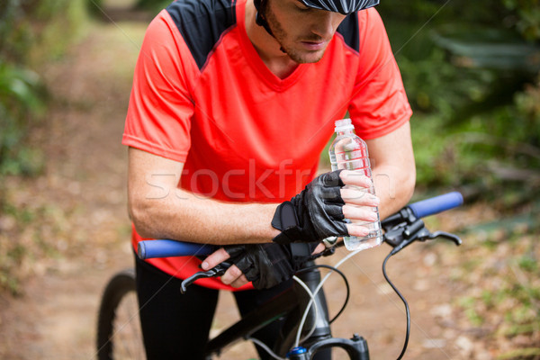 Male cyclist taking break during cycling Stock photo © wavebreak_media