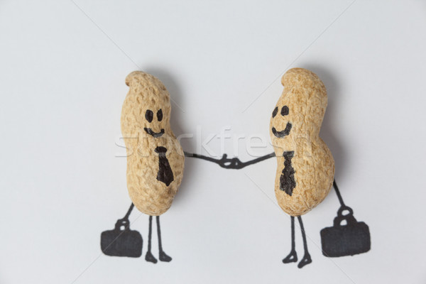 Figurina doua oameni de afaceri strângere de mână imagine Imagine de stoc © wavebreak_media